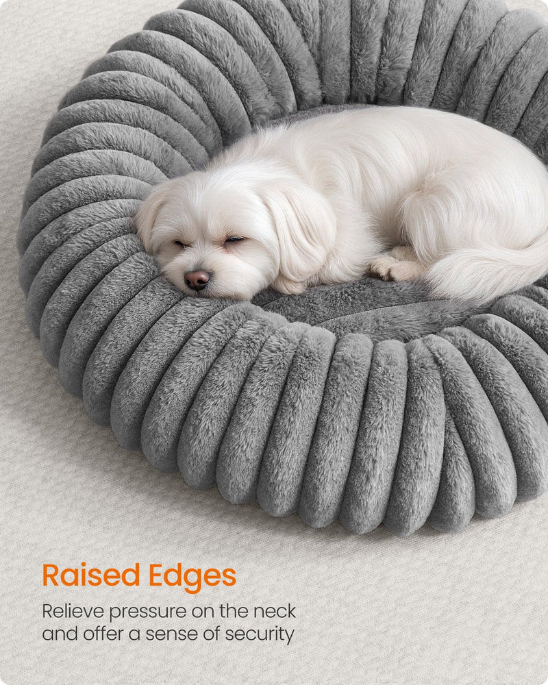 Close-up of a dog leaning against the raised rim edge of the Feandrea dove grey pet bed