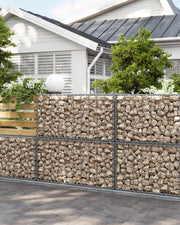 Songmics gabion cage wall used as a garden boundary in front of a house