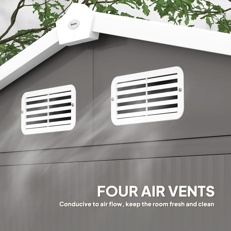 Close-up of the light grey shed's apex roof ridge cap and two white louvred air vents