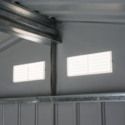 Inside the shed looking up at the galvanised roof purlin and two louvred vents in the gable