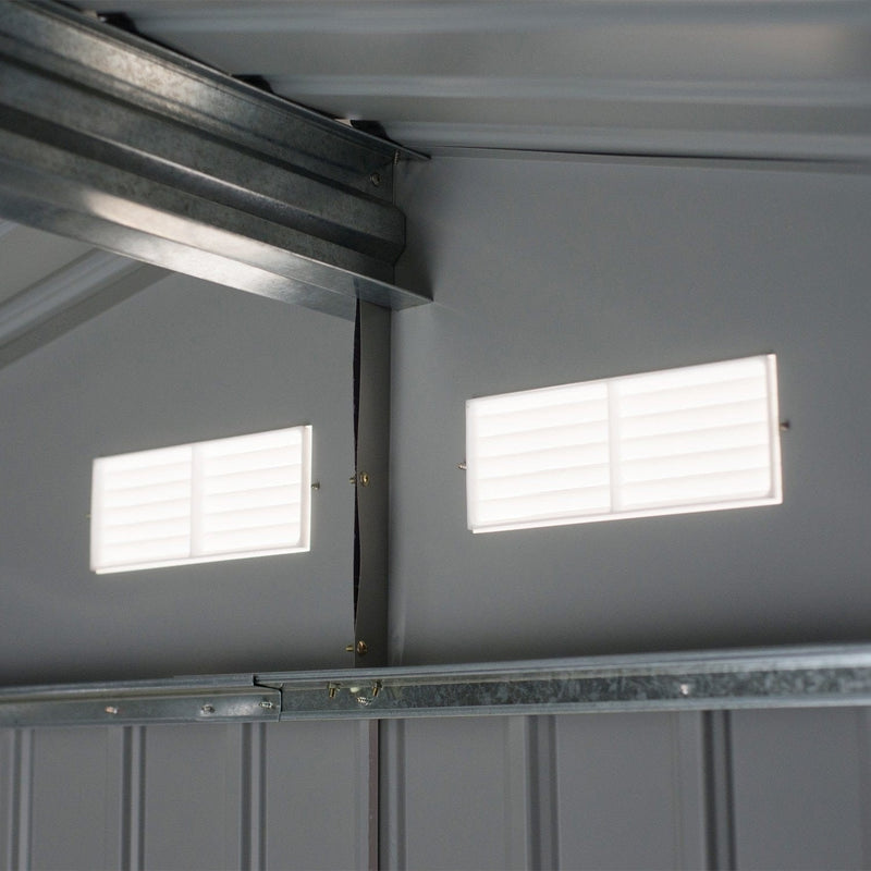 Inside the shed looking up at the galvanised roof purlin and two louvred vents in the gable