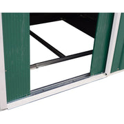 Green sliding door pushed open showing the bottom running track and black steel base frame