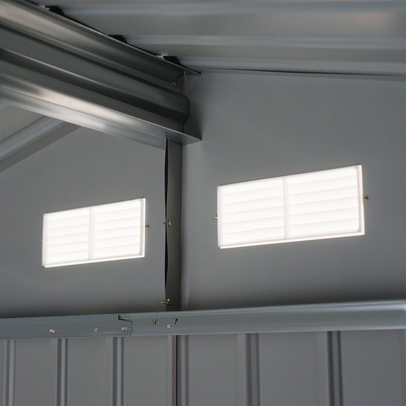 Interior of the shed showing the ridge beam and two white louvred vents set in the gable