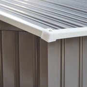 Close-up of the white corner cap where the apex roof panels meet the grey shed wall