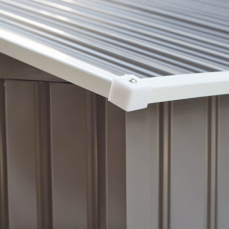 Close-up of the white corner cap where the apex roof panels meet the grey shed wall