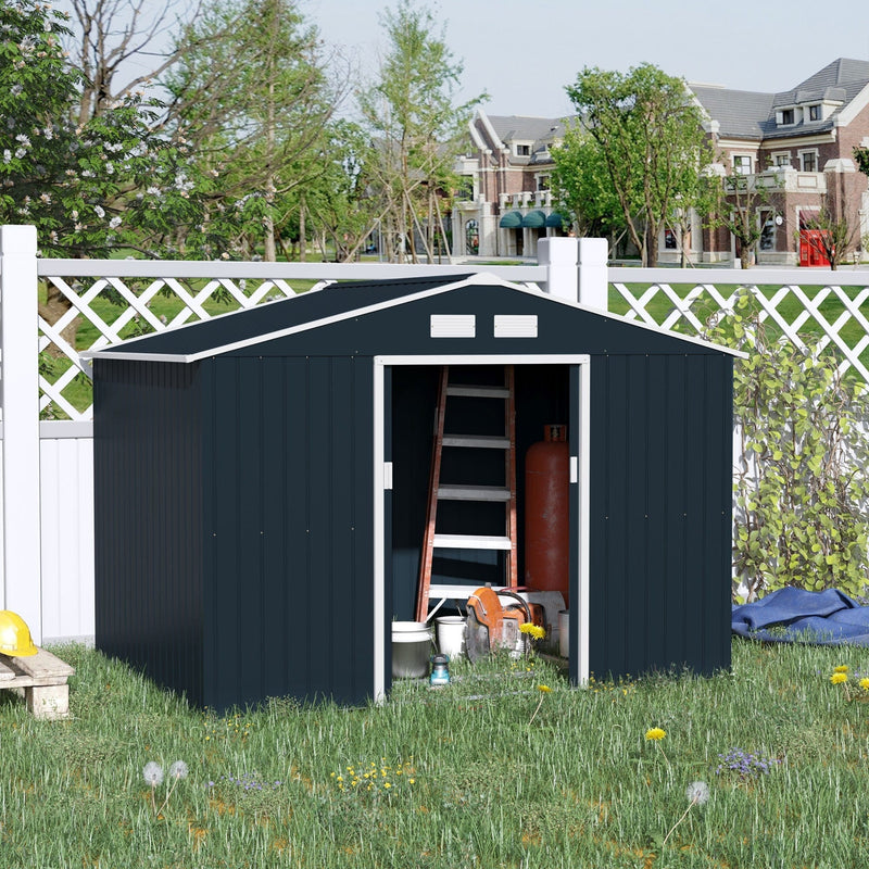 Dark grey shed on a lawn by a white lattice fence, doors open with a stepladder stored inside