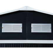 Close-up of two white louvred ventilation panels on the dark grey shed gable end