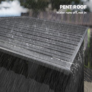 Close-up of the pent roof running rainwater off the edge of the dark grey shed
