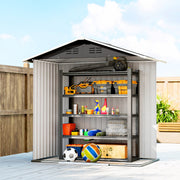 Dark grey metal shed open beside a wooden fence, filled with tools, tins and boxes