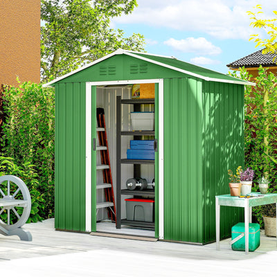 Green metal shed on a garden patio with the sliding doors open showing stored equipment