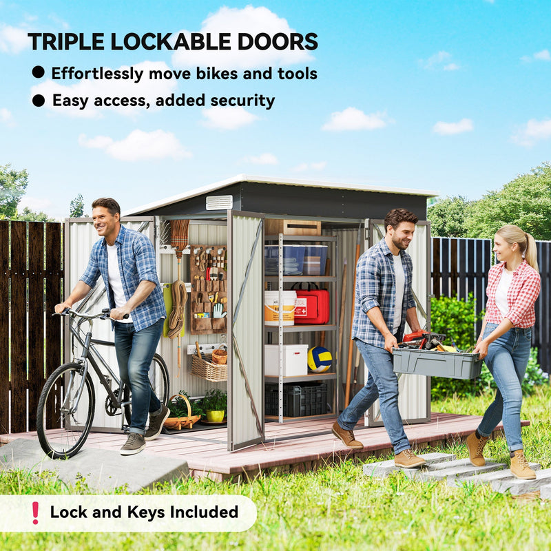 Couple moving a bike and a toolbox beside the shed with all three doors open