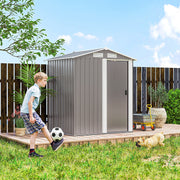 Grey apex shed on grass beside a wooden fence with a child and a dog in the garden