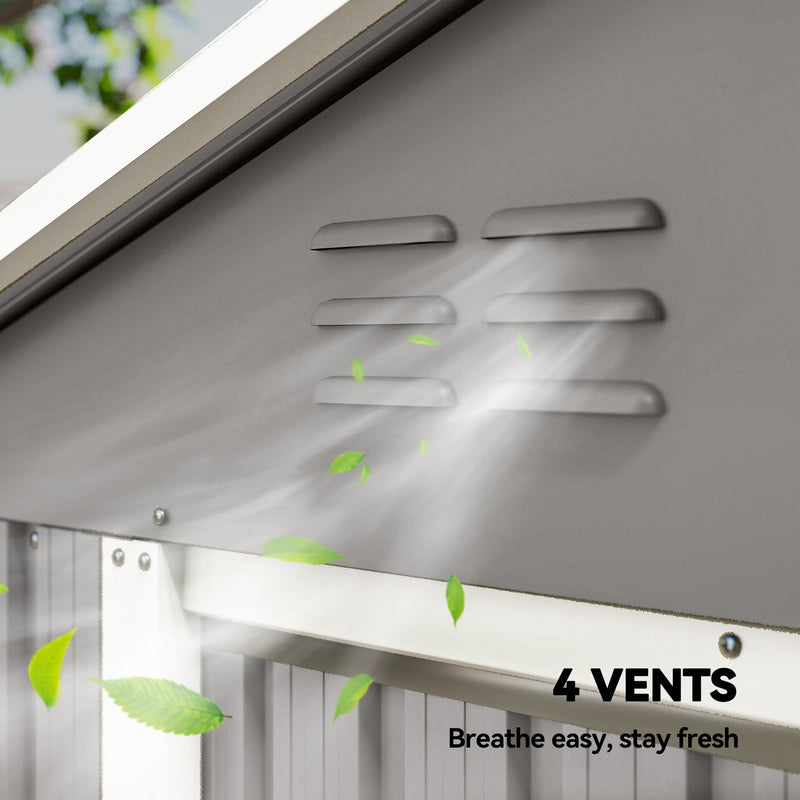 Close-up of the four ventilation vents in the shed's light grey gable panel