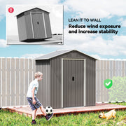 The shed sited against a garden fence to reduce wind exposure and improve stability