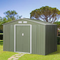 Light green 9x6ft metal garden shed on a lawn with a stepping stone path