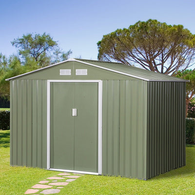 Light green 9x6ft metal garden shed on a lawn with a stepping stone path
