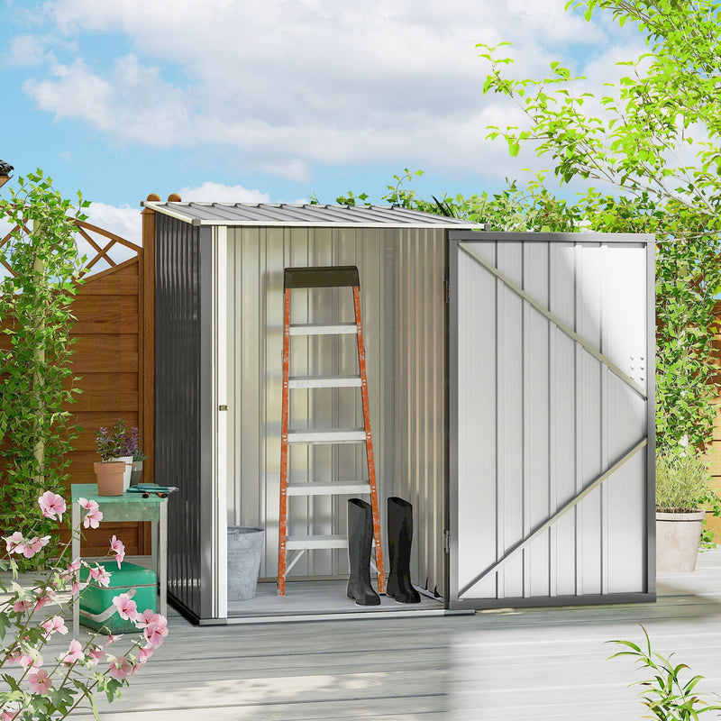Grey lean-to shed open on a garden deck with a step ladder and wellington boots stored inside