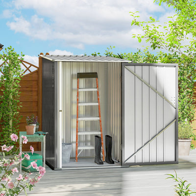 Grey lean-to shed open on a garden deck with a step ladder and wellington boots stored inside