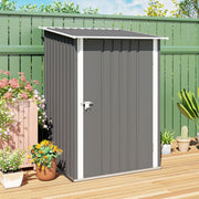 Closed grey lean-to shed on decking against a green fence with potted plants