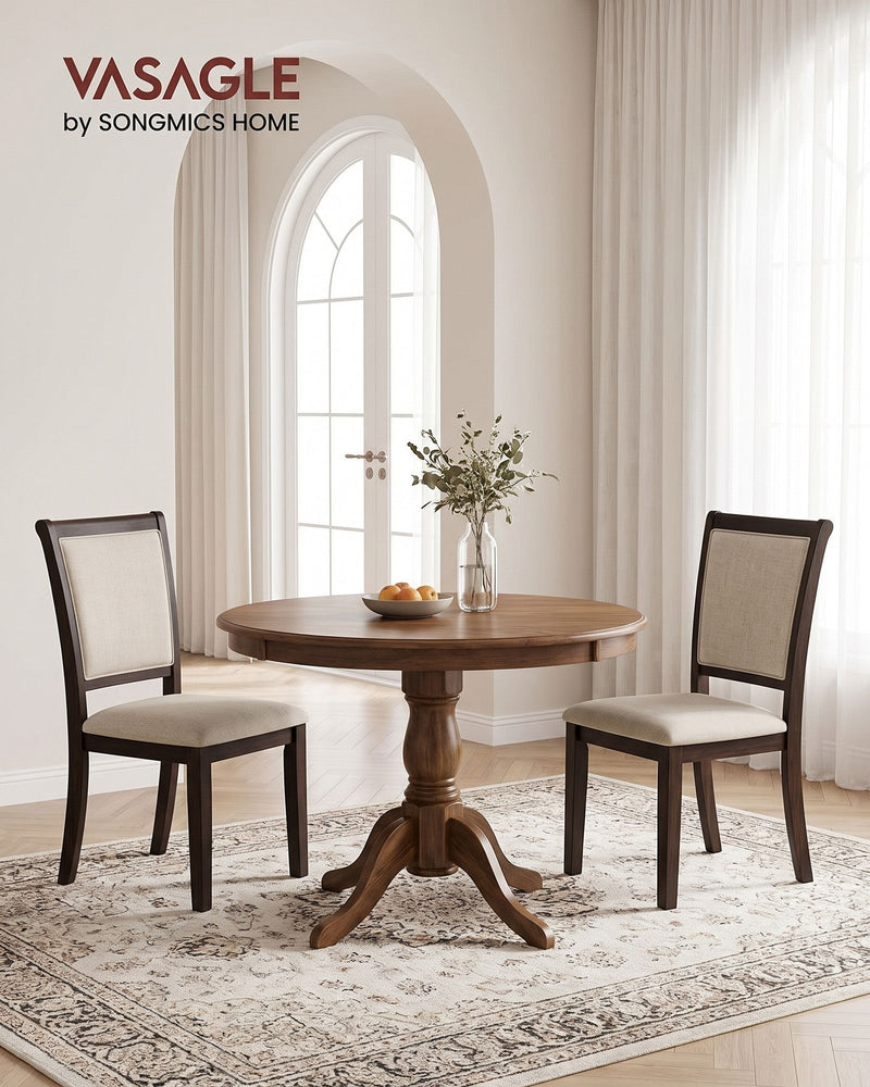 Light beige Vasagle dining chairs around a round wood dining table