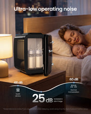 Black mini fridge on a bedside table with baby bottles inside, marked 25 dB next to a sleeping mother and baby