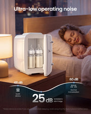 White mini fridge on a bedside table holding baby bottles beside a sleeping mother and baby, labelled 25 dB running noise