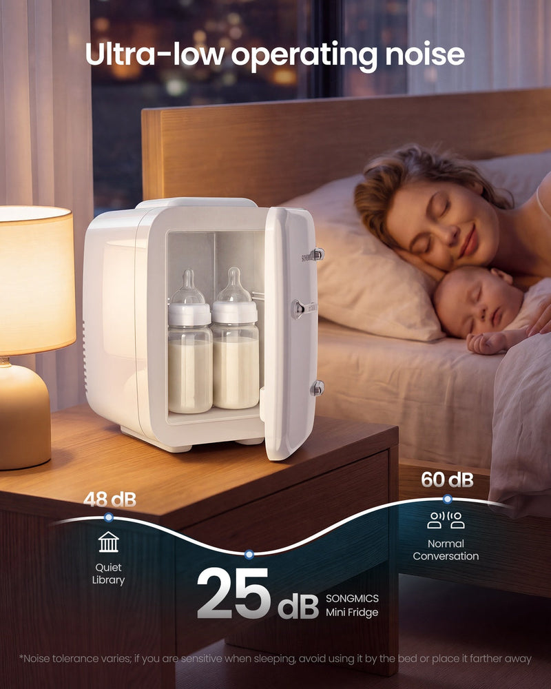 White mini fridge on a bedside table holding baby bottles beside a sleeping mother and baby, labelled 25 dB running noise