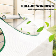 Close-up of a roll-up greenhouse window rolled back and tied against a wooden fence