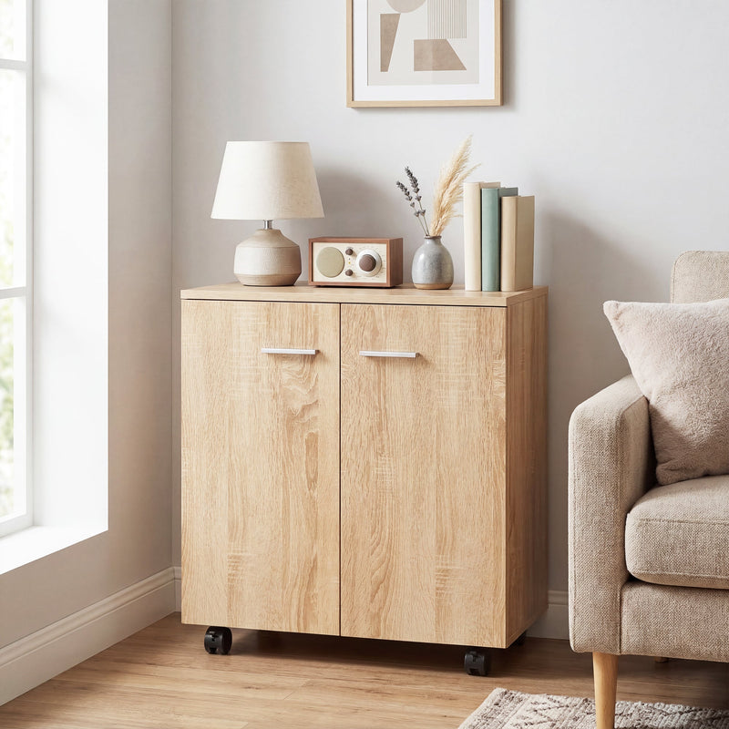 Natural wood sideboard beside a sofa with a lamp and books on top