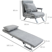 Dark grey chair bed styled in a living room with side table and plant
