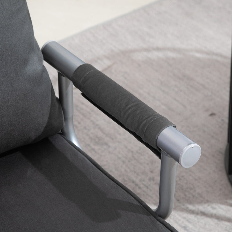 Close-up of padded armrest on dark grey chair bed