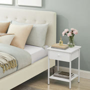 Vasagle bedside table lifestyle shot next to a bed with lamp