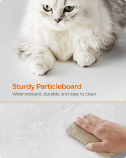 Long-haired cat on the white cat tree above a close-up of the particleboard surface being wiped