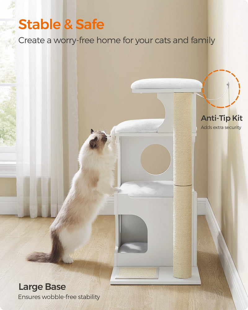 Cat stretching up the sisal post of the white cat tree, which is fitted with an anti-tip kit