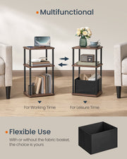 Side table styled for working time with a laptop and for leisure time with flowers and a teacup
