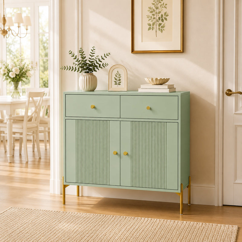 Light green sideboard styled in a hallway with a vase and framed print