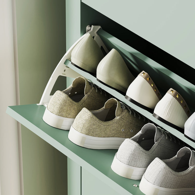 Close-up of shoes arranged on the cabinet's open drawer shelf