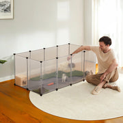 Small pet inside the white modular playpen at home