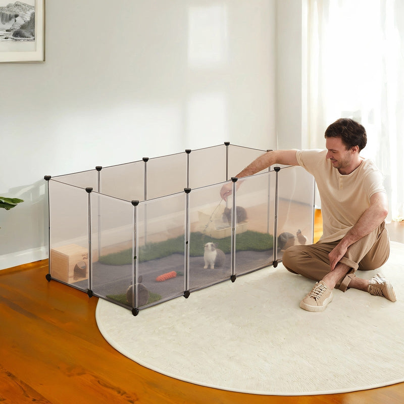 Small pet inside the white modular playpen at home