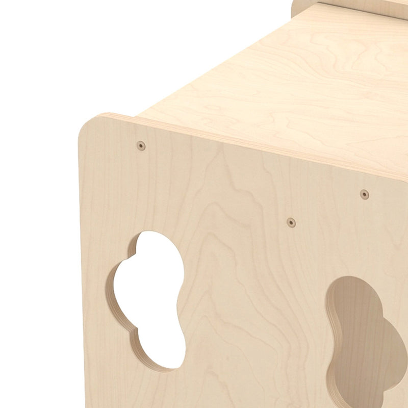 Close-up of the plywood grain and cloud cut-out on the toddler table
