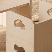 Close-up of the cloud-shaped cut-out handle on the toddler chair