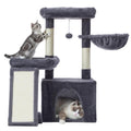 Studio shot of the Feandrea multi-level cat tree in Dark Grey with a cat on the scratching post and one resting in the hanging basket