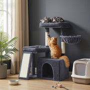 Lifestyle photo of a cat sleeping on the top platform and another climbing the scratching post