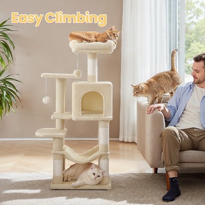 Close-up of the cosy cave and sisal scratching posts on the beige cat tree