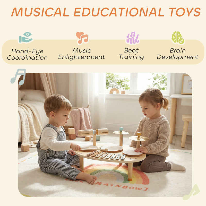 Two children playing together with the musical instrument set on a rainbow rug