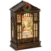 Bronze tone snow globe lantern with a snowman scene and wreath on white background