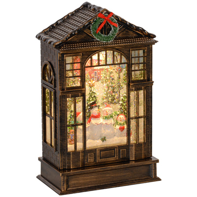 Bronze tone snow globe lantern with a snowman scene and wreath on white background