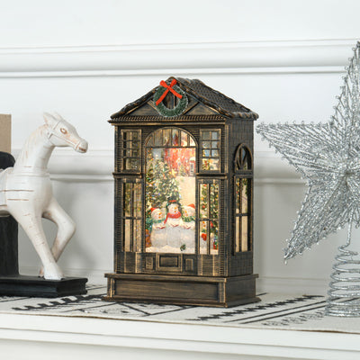 Snow globe lantern on a white shelf beside a white horse ornament and silver star