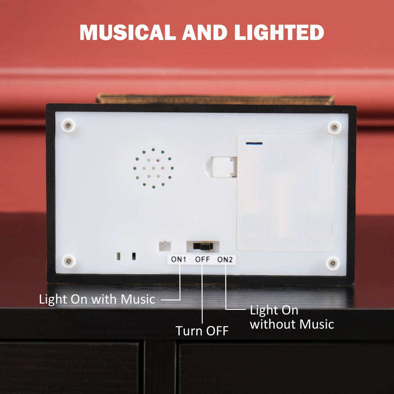 Underside of the lantern showing the three-position switch for light with music, off and light without music