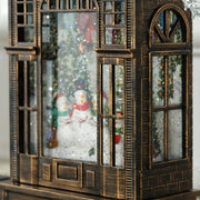 Close-up of the snowmen scene with falling glitter inside the lantern window